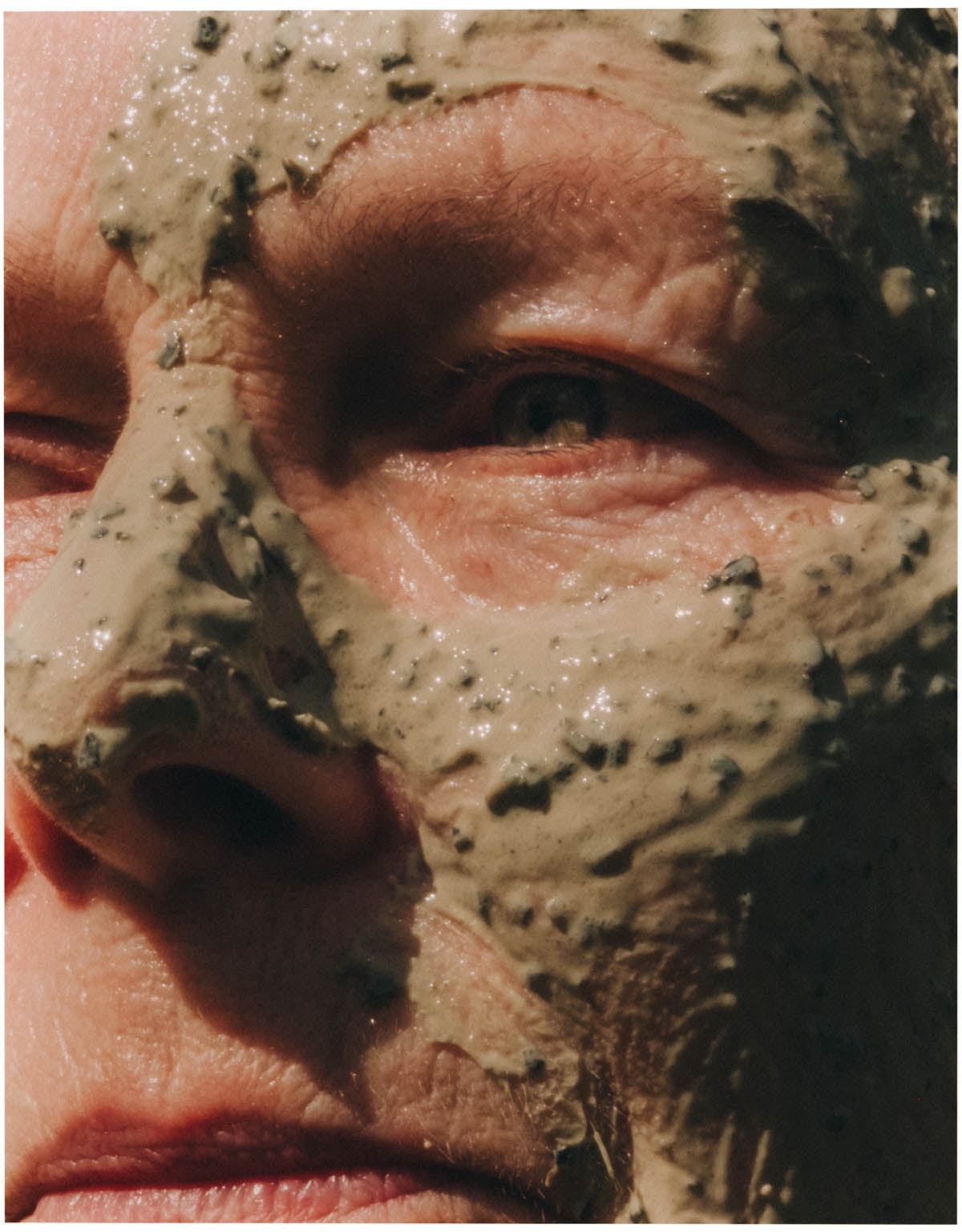 Hands working balm into dry skin